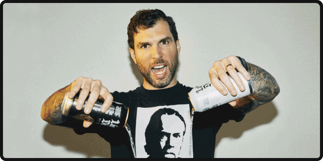 Founder of Liquid Death pouring out two cans of the beverage.