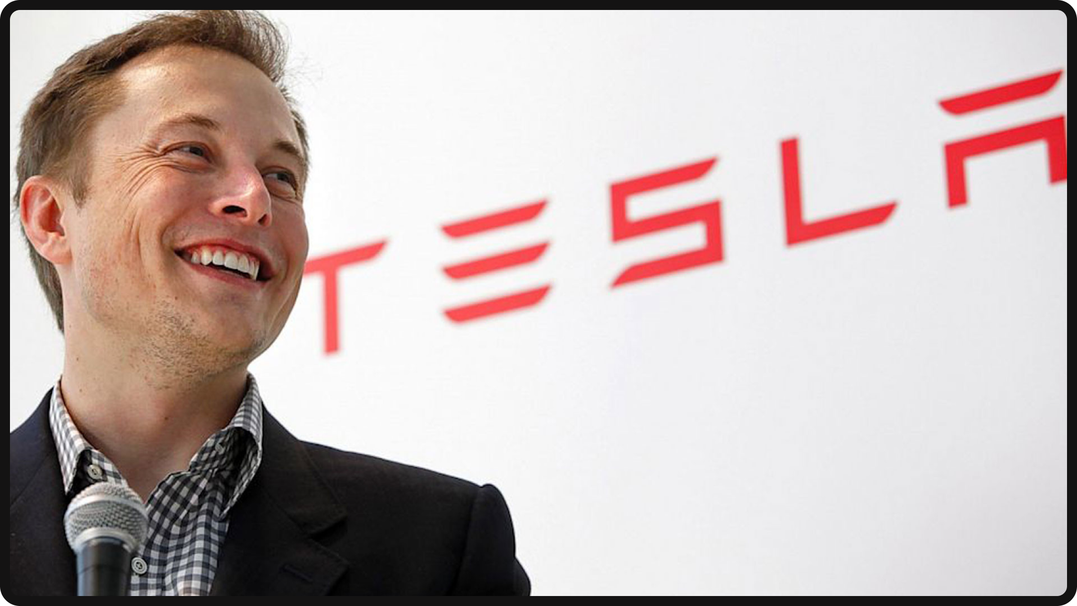 Elon Mush with Tesla logo
