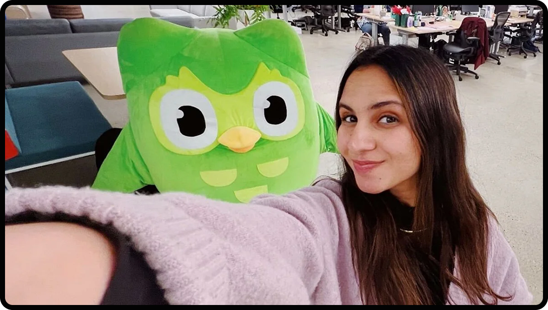 Photo of Duolingo's Social Media Manager with Duo the Owl