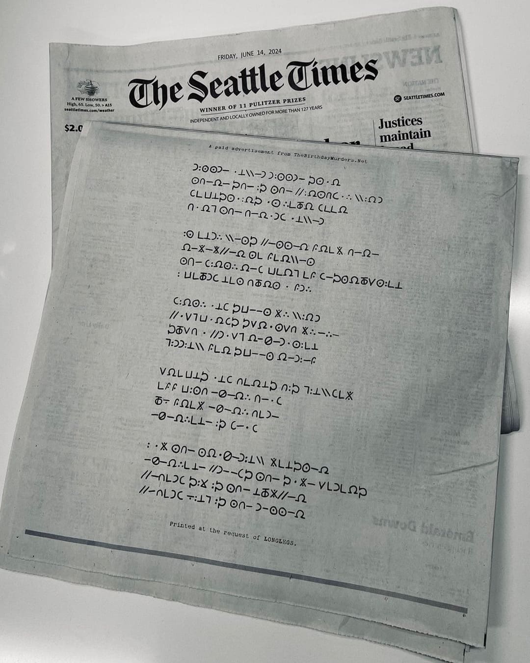 a real-life promotional cipher advertisement for the horror thriller film Longlegs, published in The Seattle Times on June 14, 2024, which directs readers to the in-universe viral marketing website The Birthday Murders